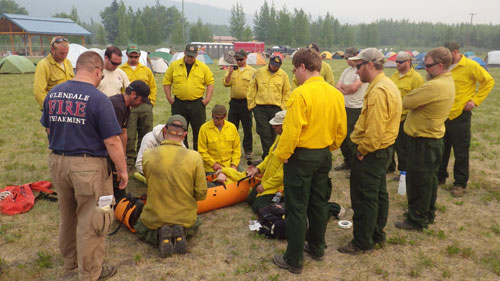 Crews receive training on assembling a field stretcher