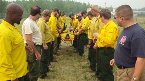 Crews receive training on proper carriage of a field stretcher