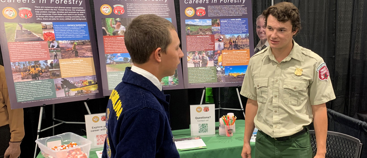 Intern Larry Roberson interacting with a student at the FFA State Convention